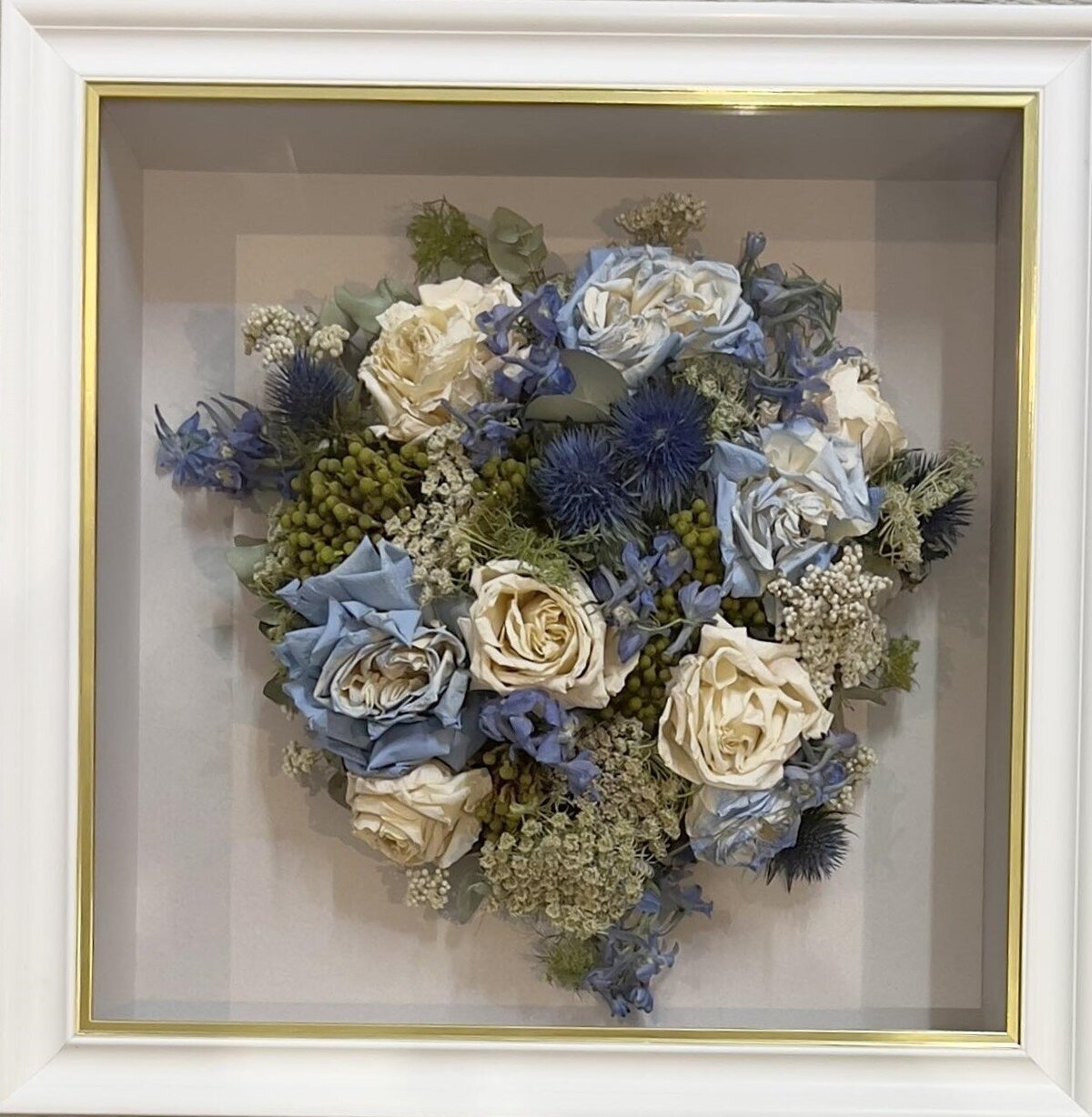 Wedding bouquet preserved in 3D frame.