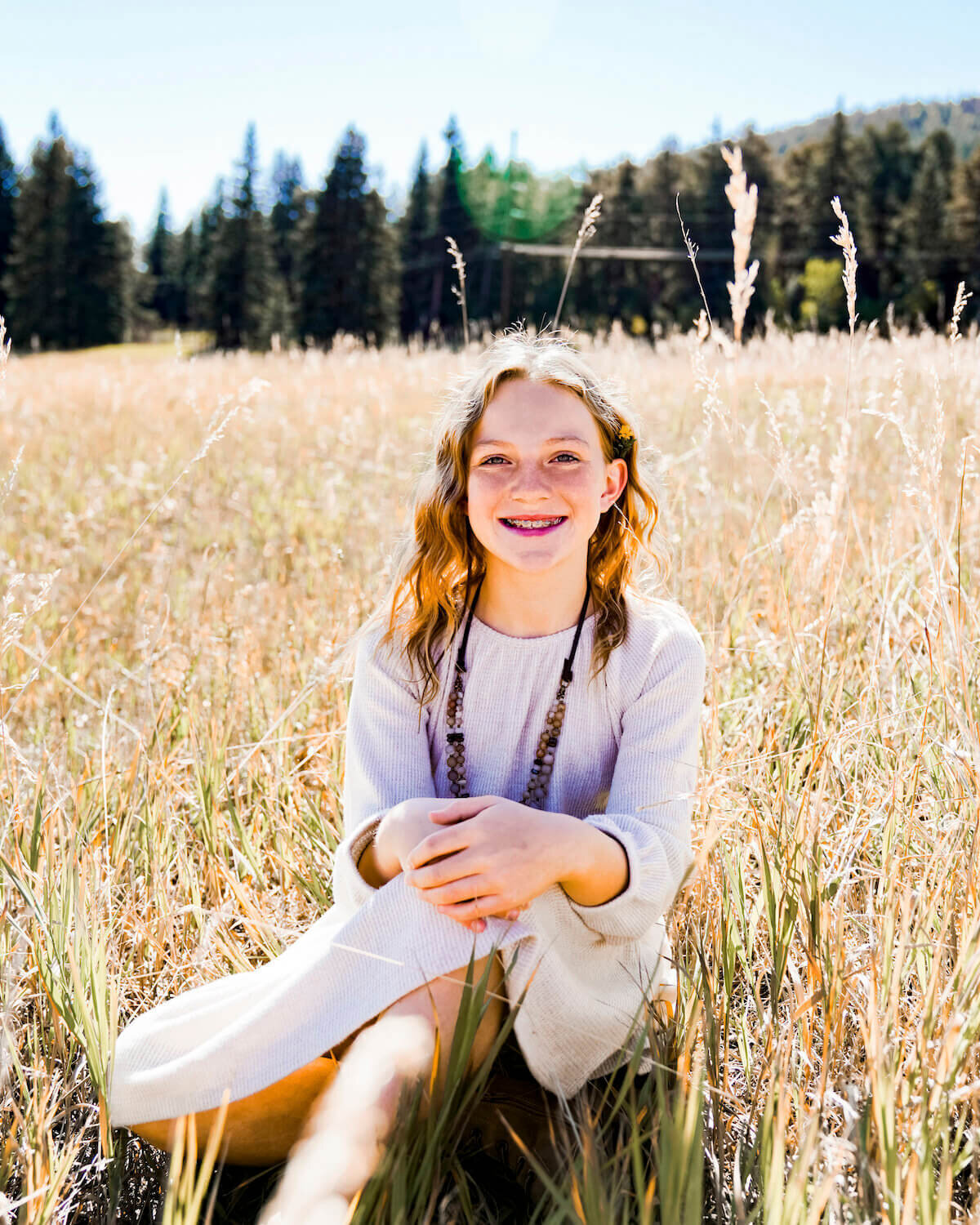 denver family photography - young girl sitting in grass