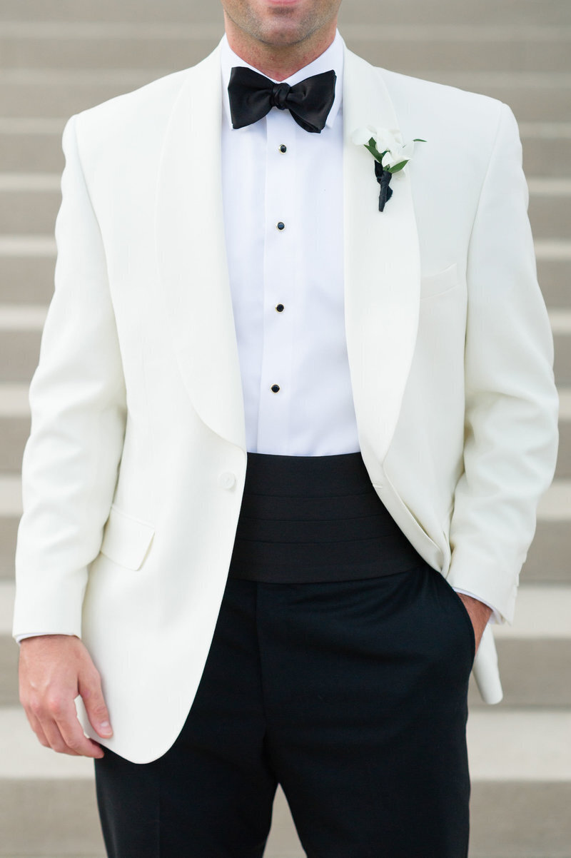 groom-detail-shot-white-black-suit-classic