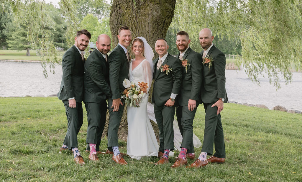 wedding party posing with their socks in Rives Junction Michigan