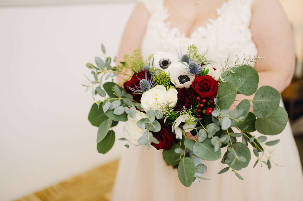 detail shot of bridal bouquet as bride holds the flowers