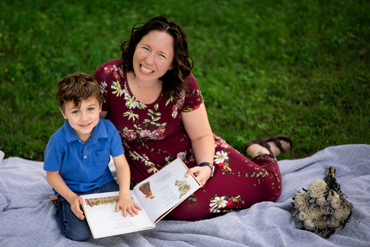 A mother and her son read together on a picnic blanket at Hayes Nature Preserve in Alabama