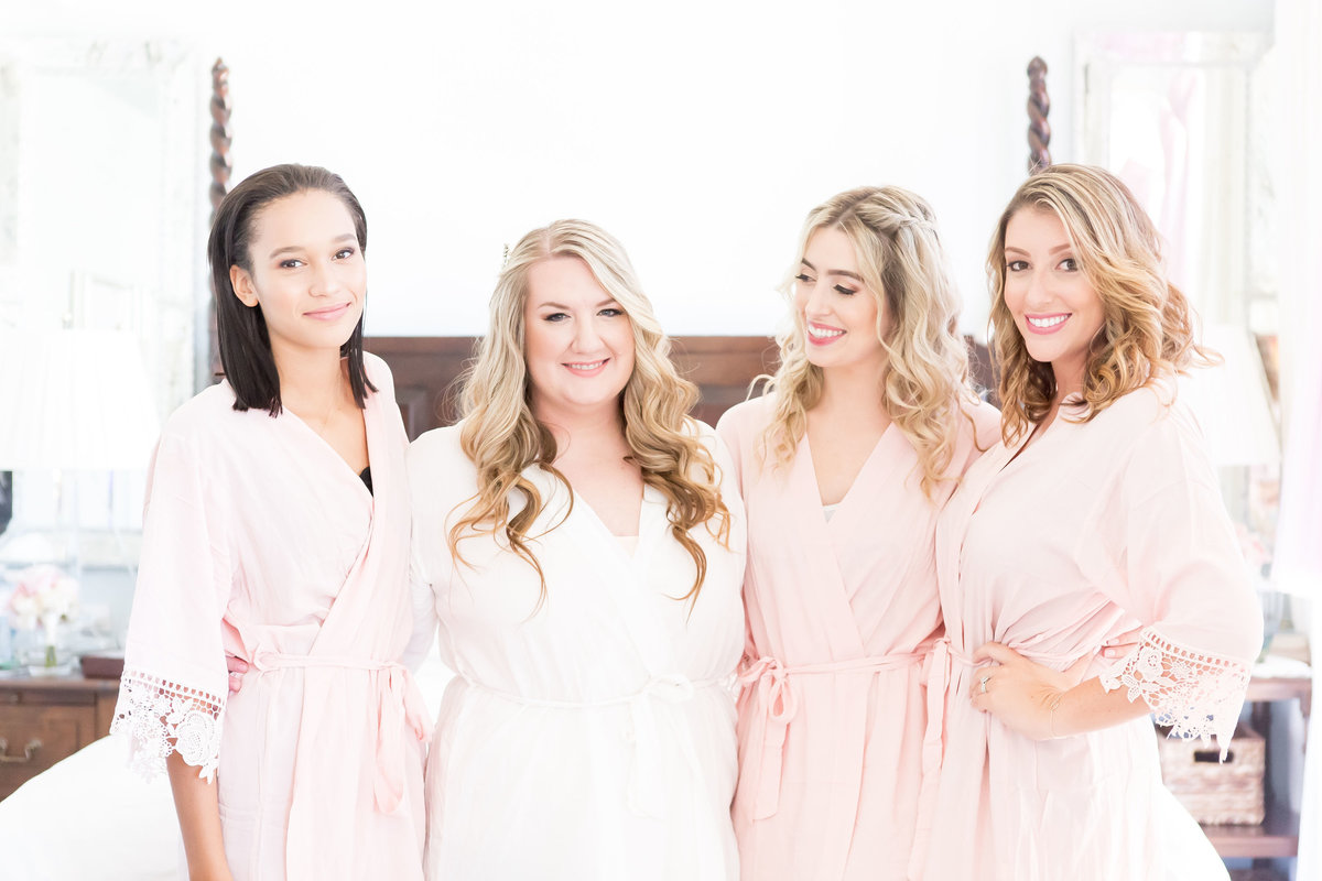 Bridesmaids in pink robes
