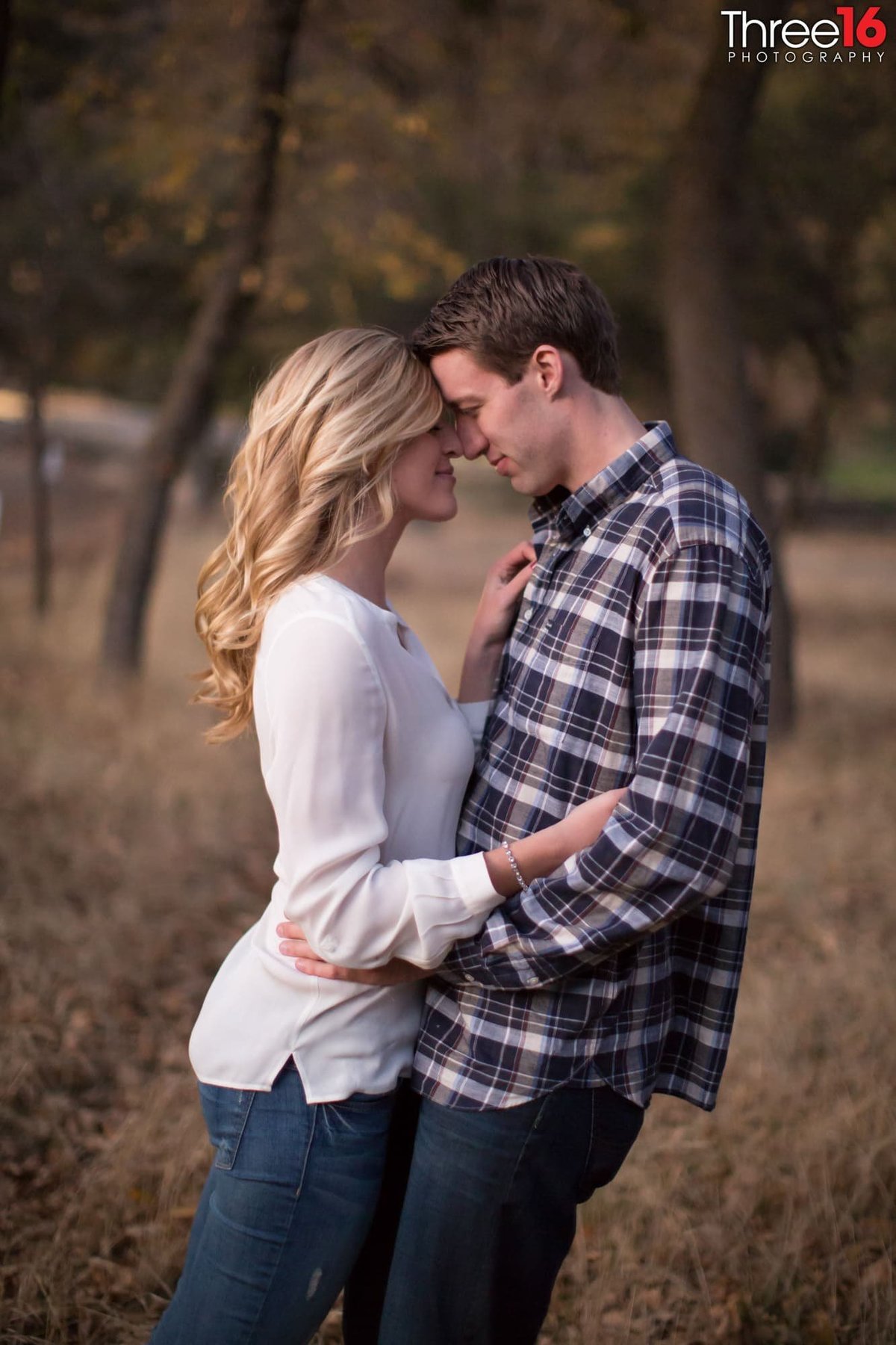 Tender moment between engaged couple during their Riley's Farm photo shoot