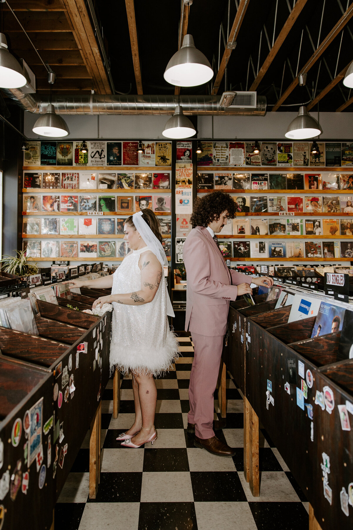 Two people look through vinyls at a Las Vegas record shop.