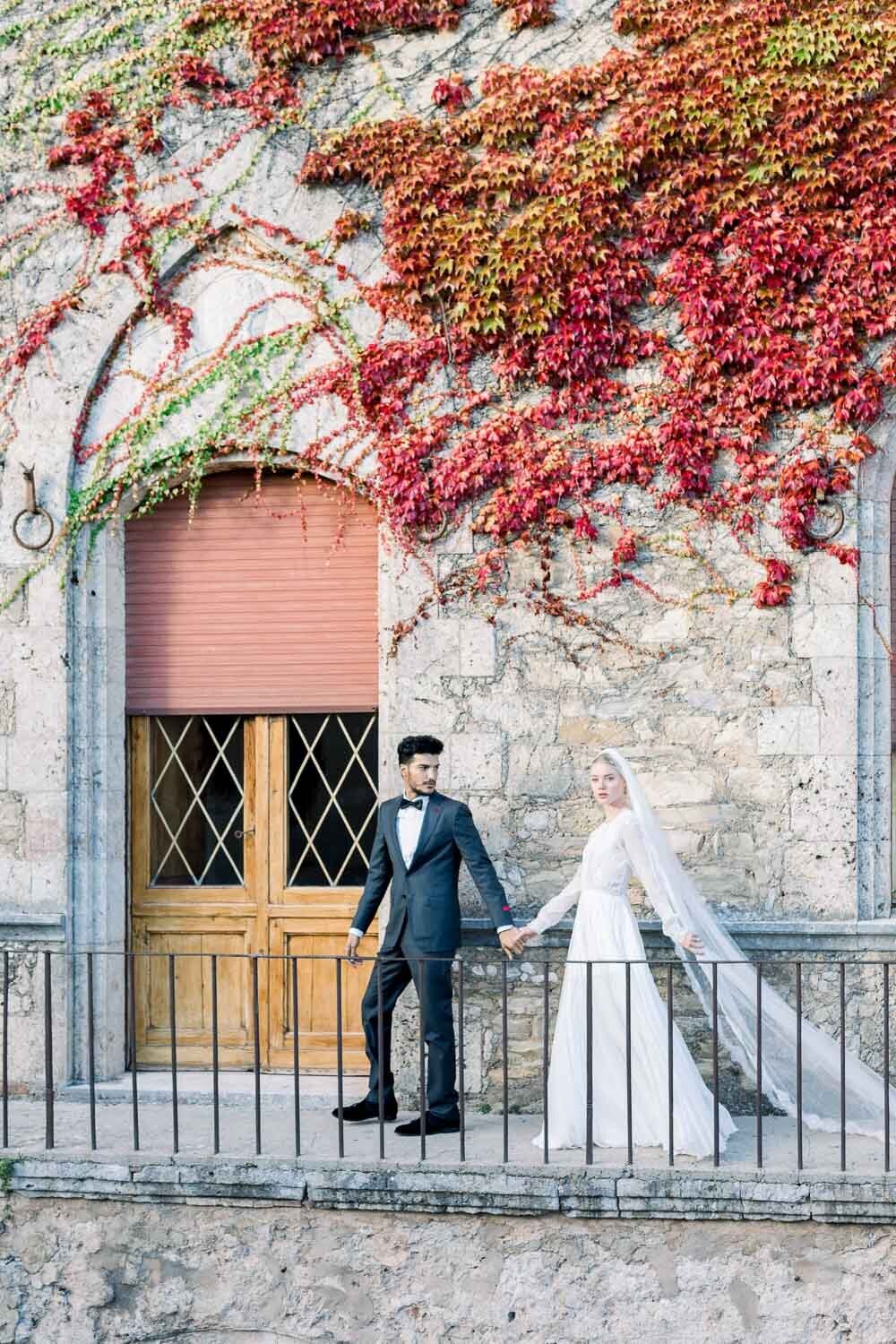 bride and groom walking in castello di celsa