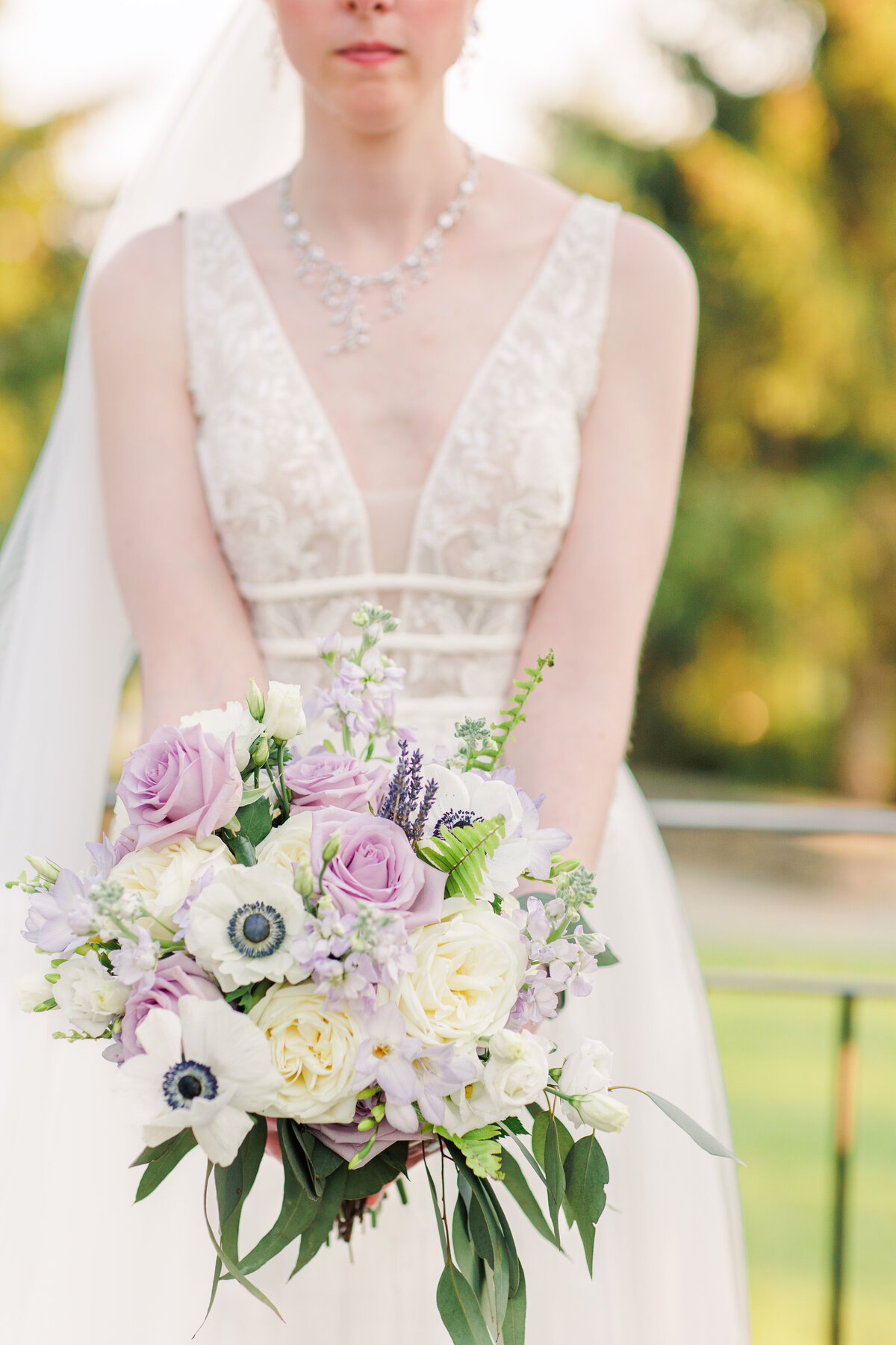 Close up of bride holding her bouquet during her Tower Hill wedding