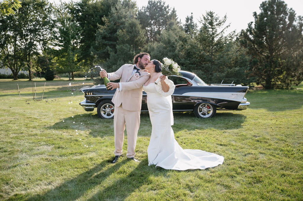 champagne popping married couple in mid Michigan