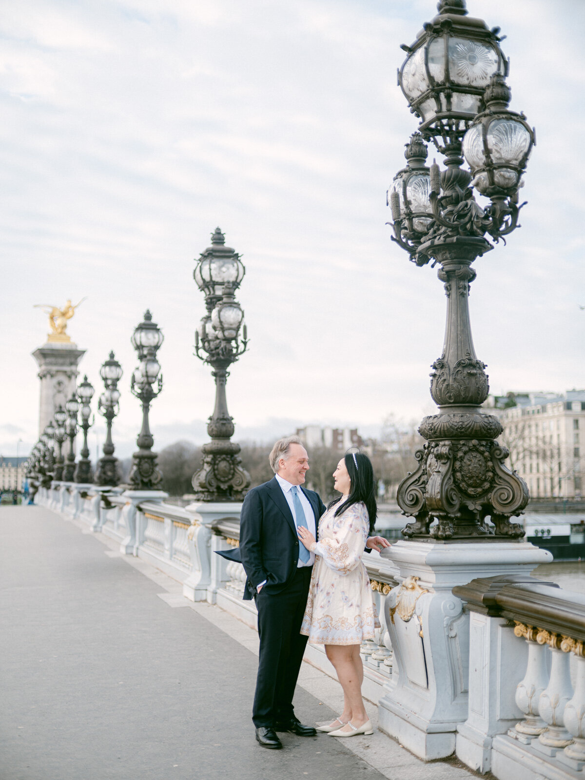sachin and babi light blue dress Planning Engagement Shoots in Winter: Cozy Paris Photo Sessions
