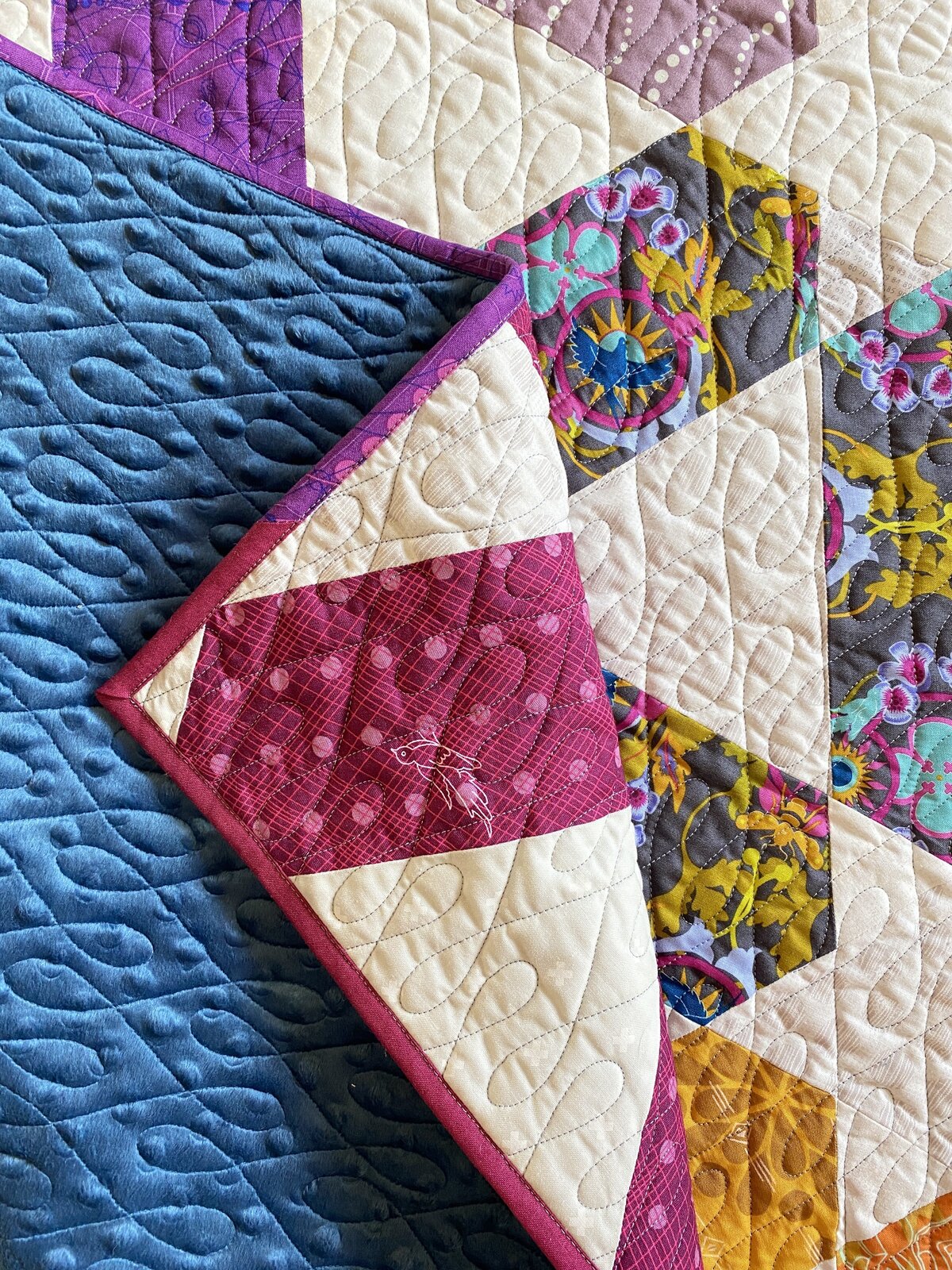crazy 8s quilting design featured on a quilt with bold colors and minky backing 