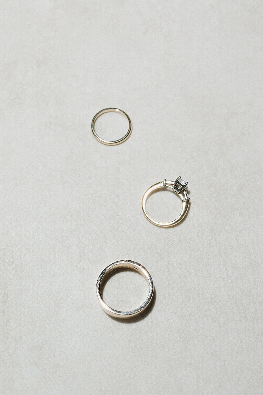 bride and groom's wedding bands on flat lay