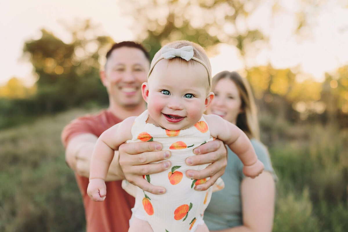 Family together in the summer sunset for their Fort Collins portrait session