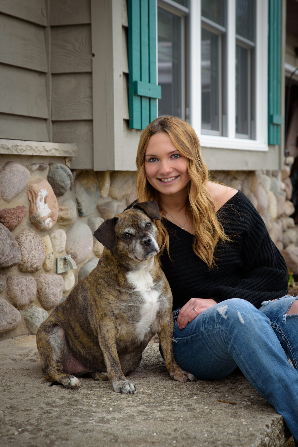 High School senior girl portrait with dog at her home in green bay, Wisconsin