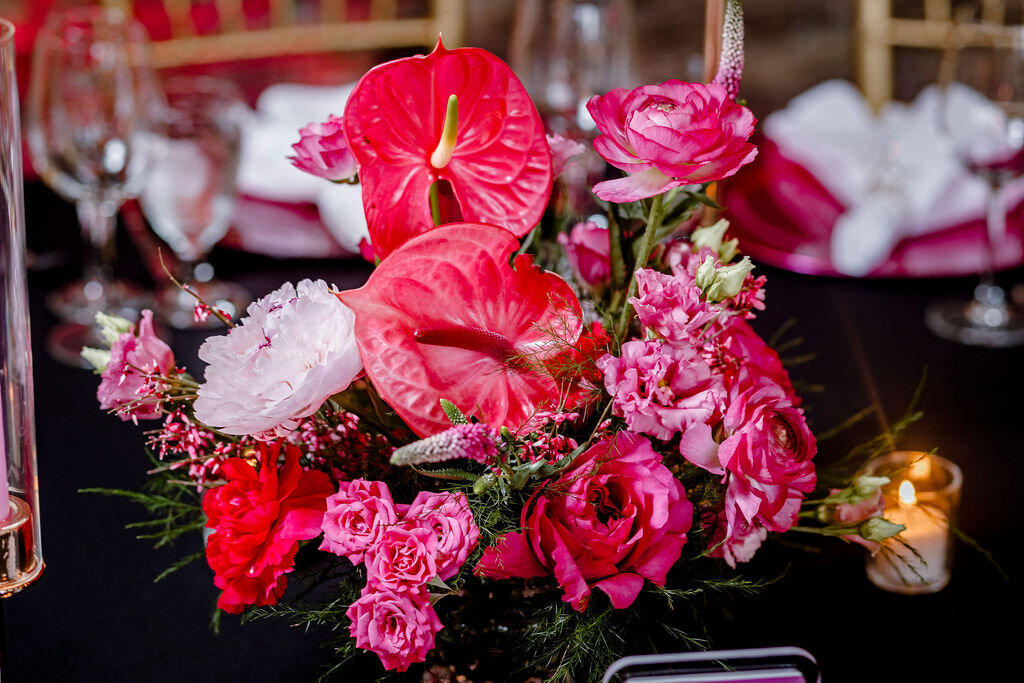 Stylish table setting with floral centerpieces and modern rentals for a bat mitzvah at Stone House NJ.