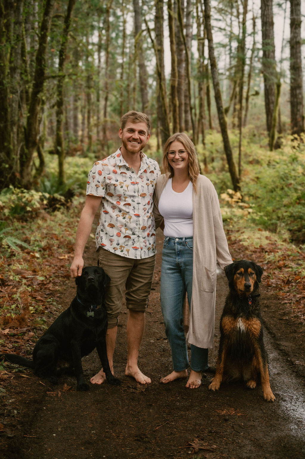 Couple portrait with dogs on trail with bare feet