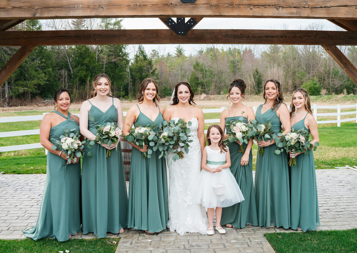Elegant wedding flat lay with rings, florals, and invitations