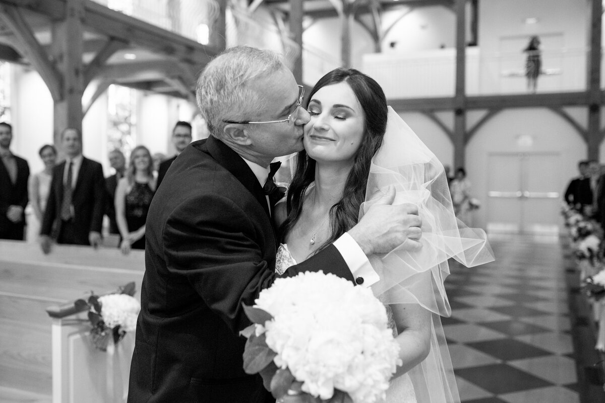 wedding ceremony photo of father of bride giving bride away