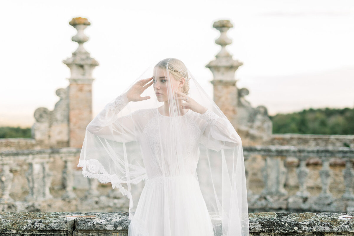 beautiful bride under veil in castello di celsa