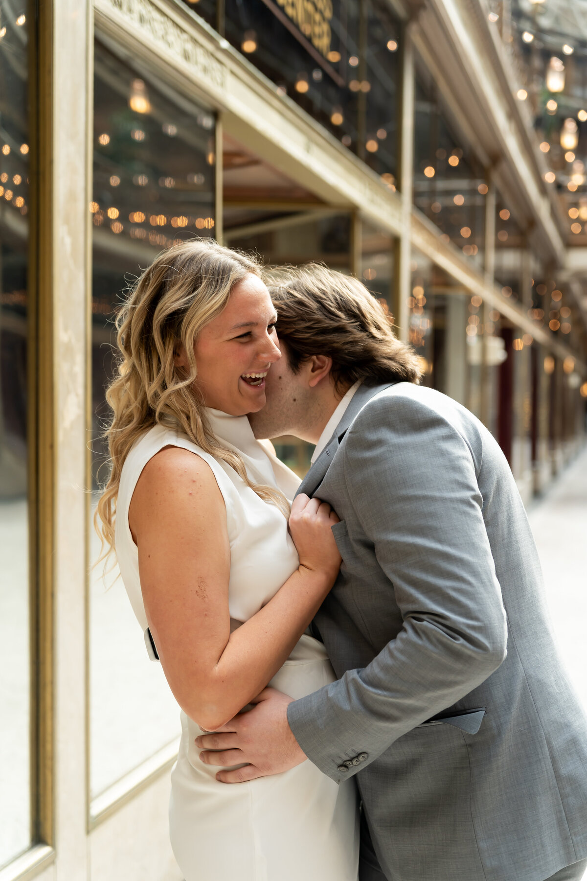 playful engagement photos at Cleveland Arcade