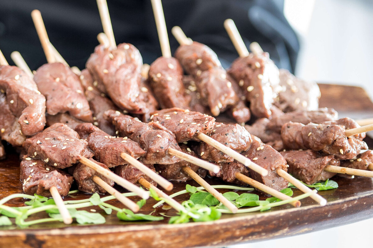 a tray of meat skewers being served as part of a corporate anniversary celebration.  Captured by Ottawa Event Photographer JEMMAN Photography COMMERCIAL