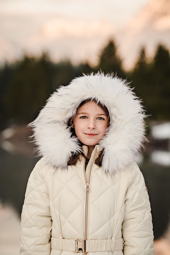girl-in-fur-hood-mountain-backdrop-child-portrait