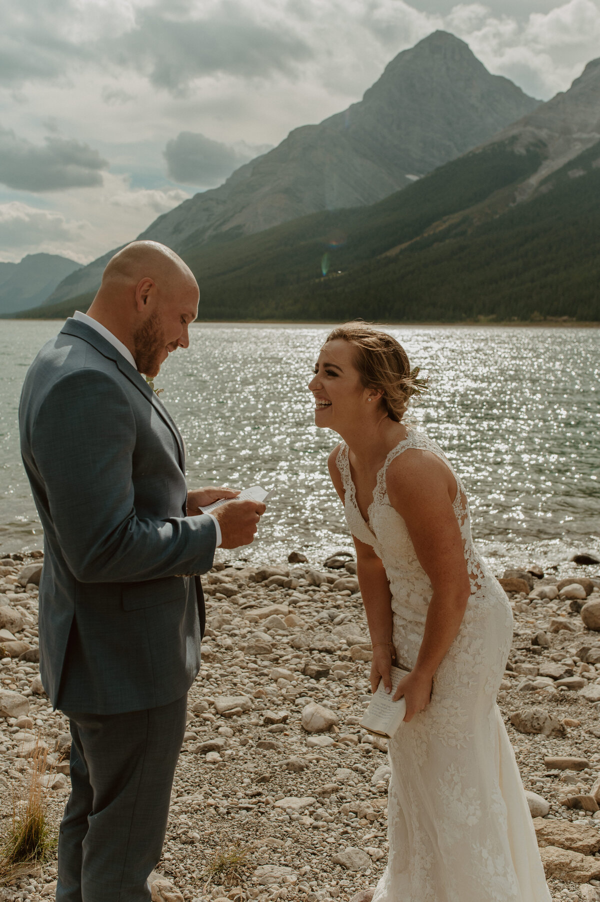 bride and groom laughing at elopement