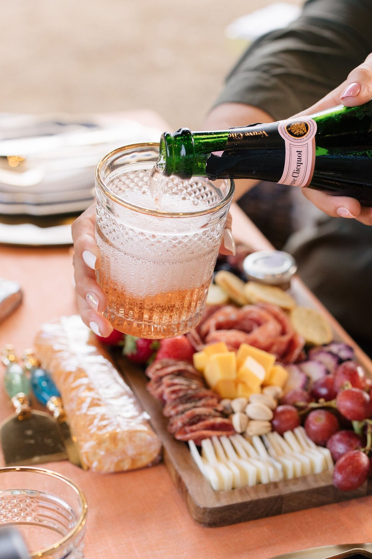 Pouring champagne at picnic