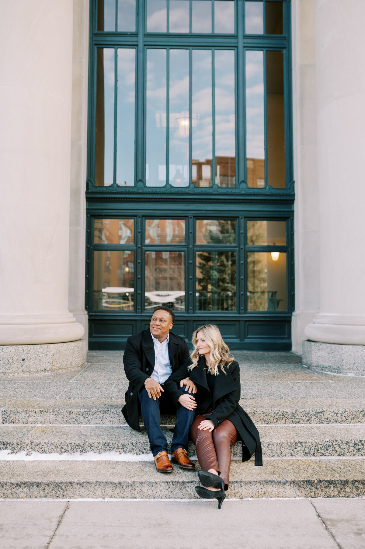 Couple sitting on steps at Union Depot in St. Paul