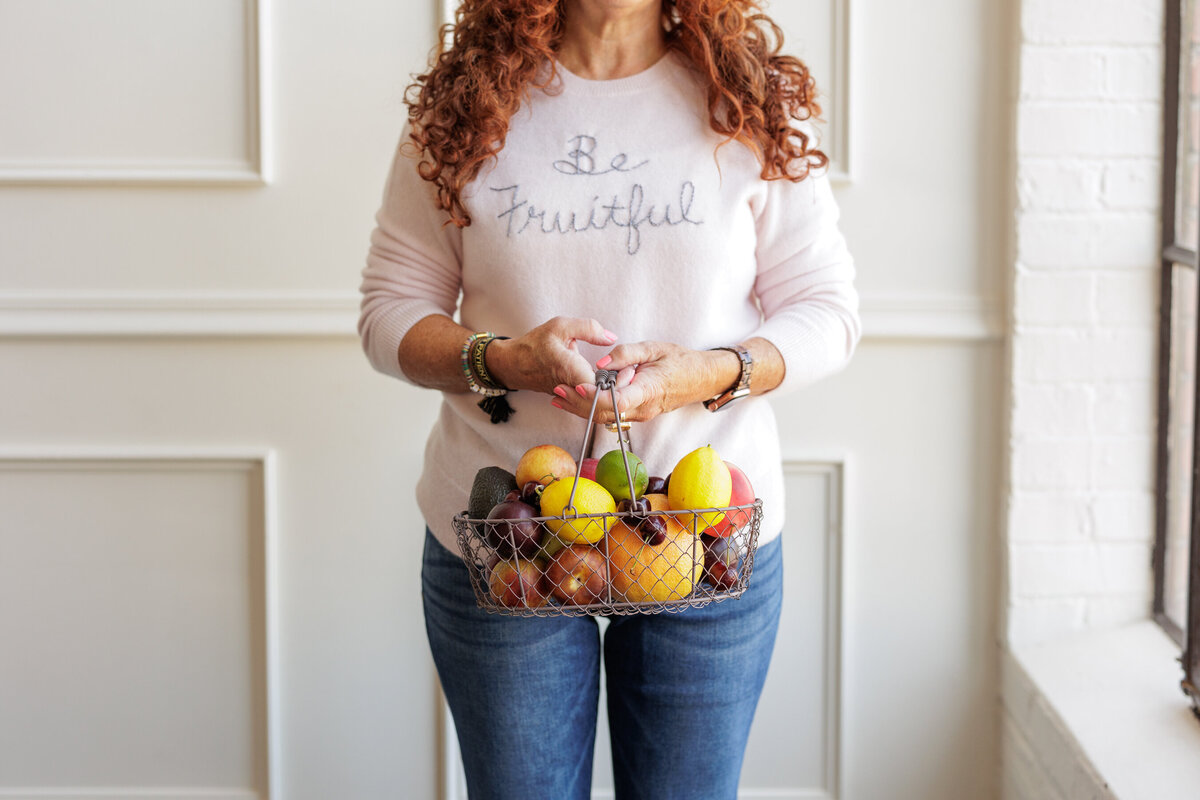 Woman holding a fruit basket