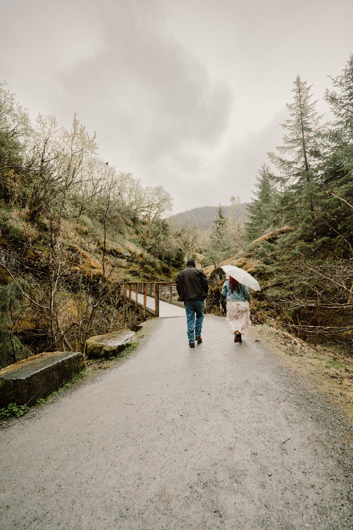 Couple hiking to the waterfall