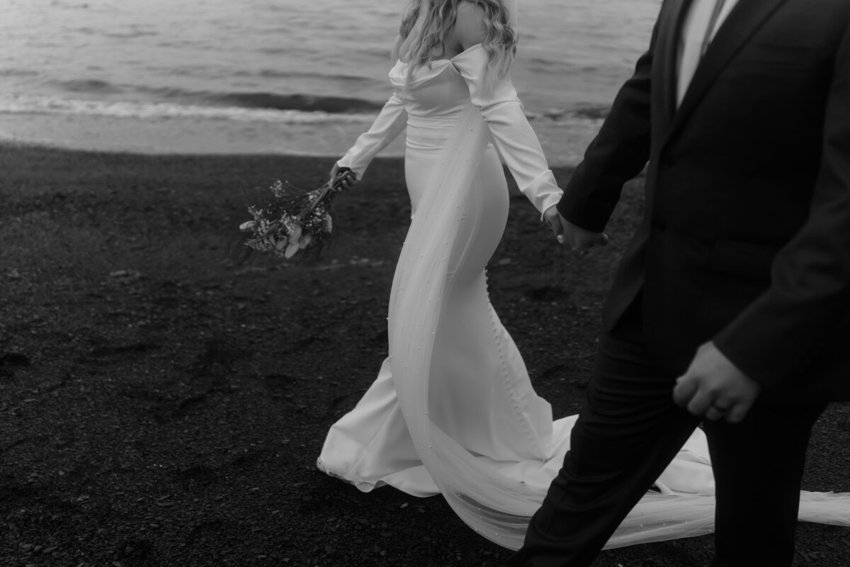 black and white photo of couple on beach