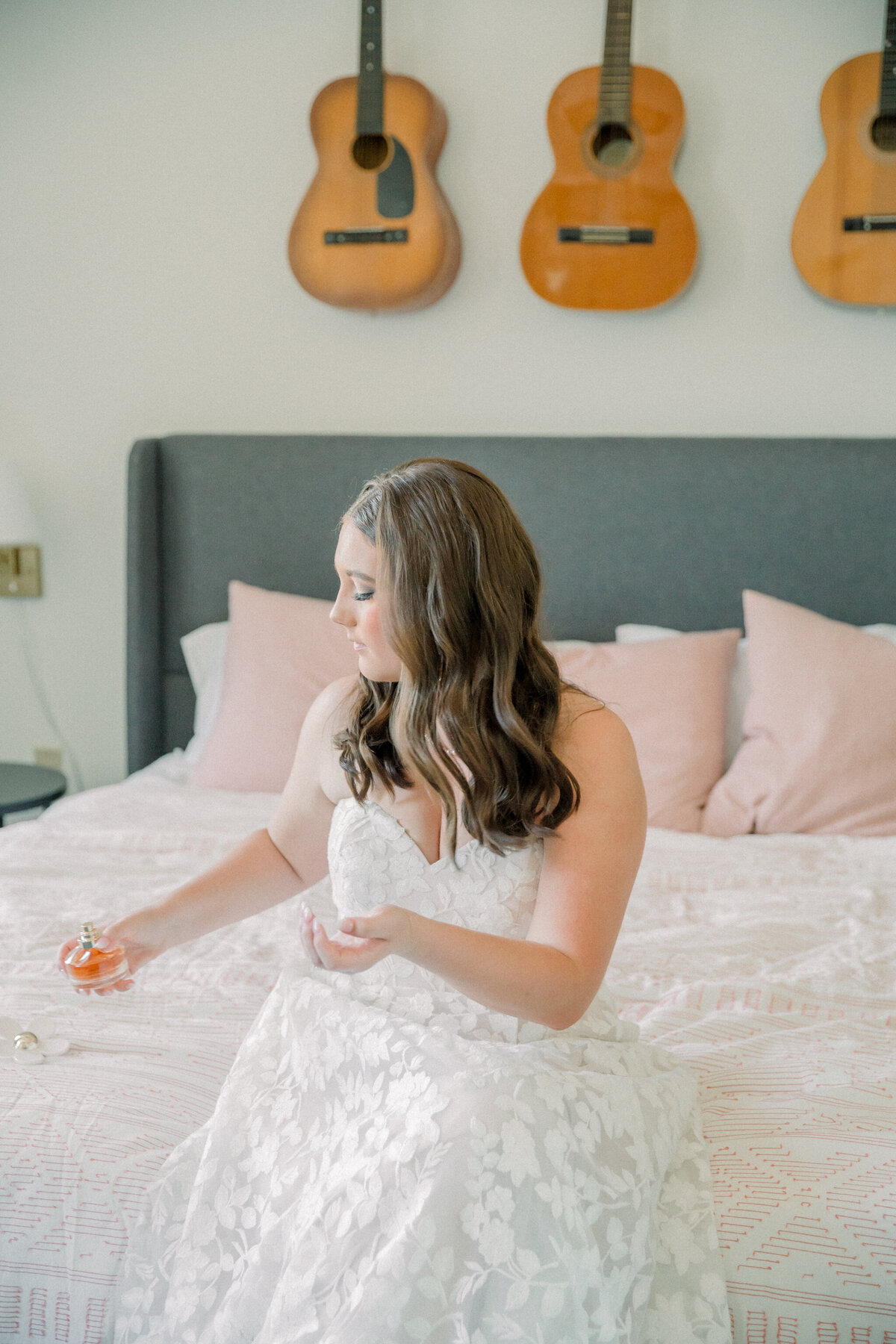 Three Oaks Manor Wedding | bride puts on perfume