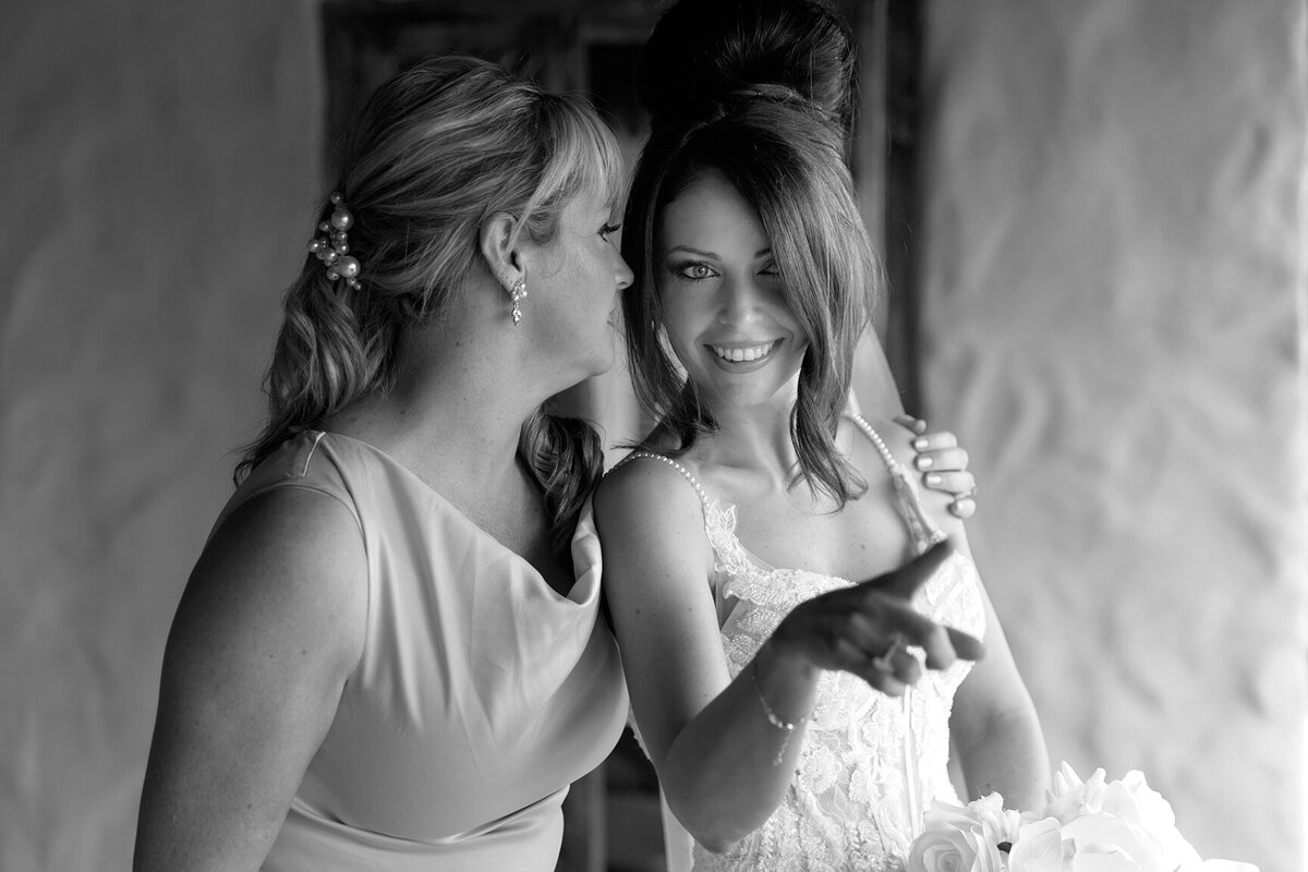 Breathtaking candid photoshoots of bride and bridesmaid at the lush Villa Botanica, in black and white.