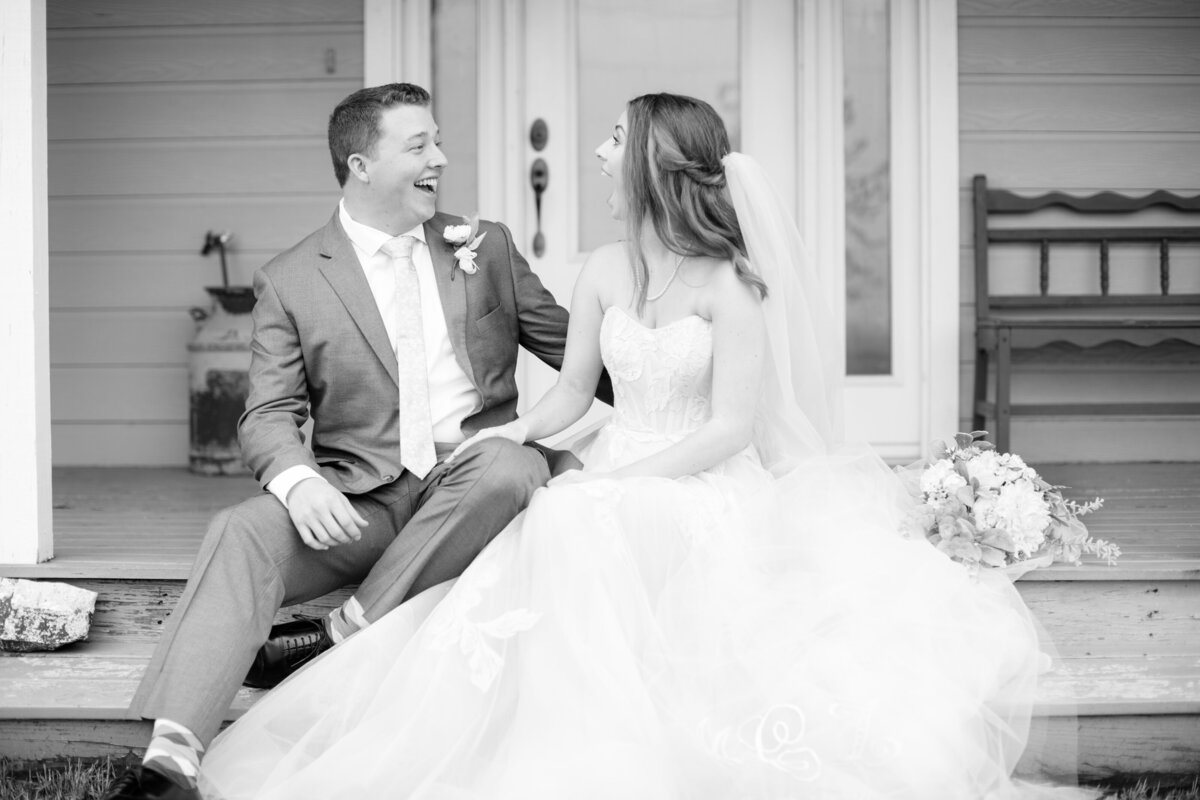 laughing on front porch of intimate wedding in New Braunfels by Firefly Photography