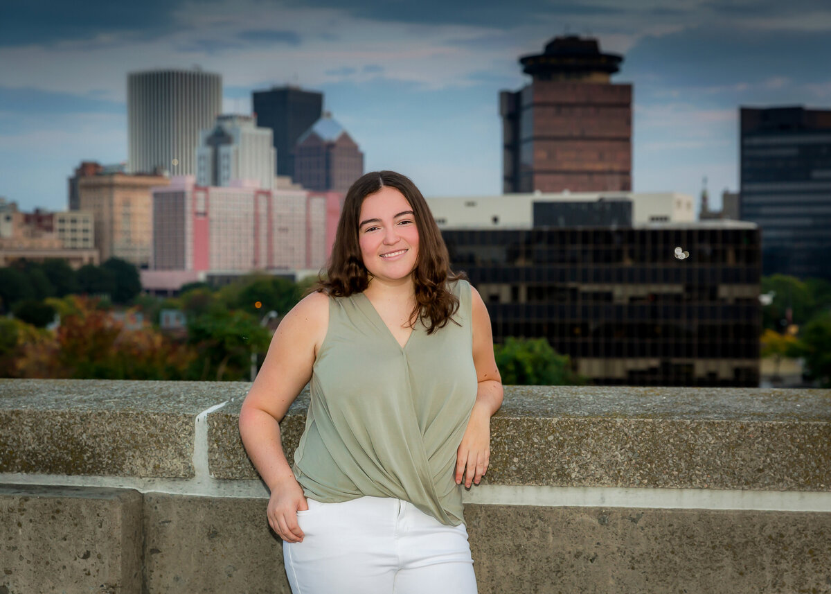 Senior picture taken with the Rochester skyline in the background