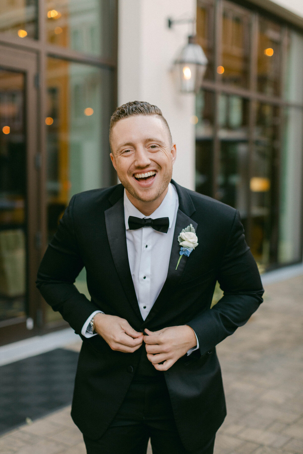 groom standing outside the NOPSI hotel