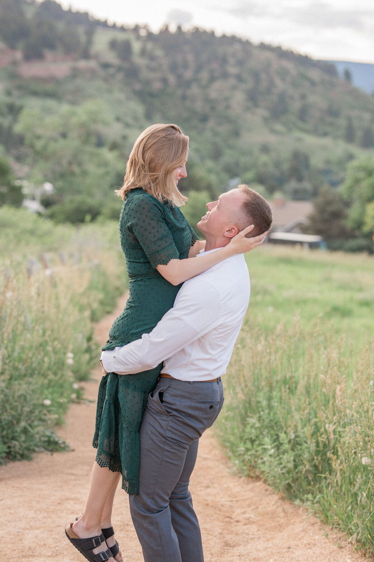 A romantic engagement session in Boulder Colorado, featuring a couple surrounded by breathtaking natural beauty