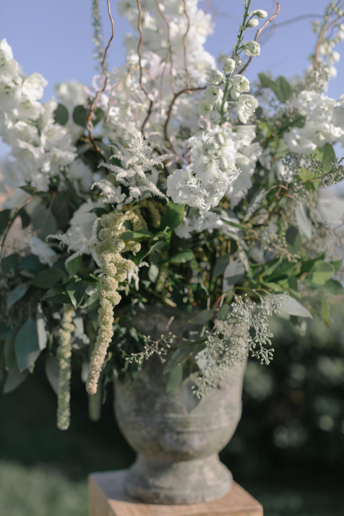 Wedding ceremony florals in vase during Maine wedding.