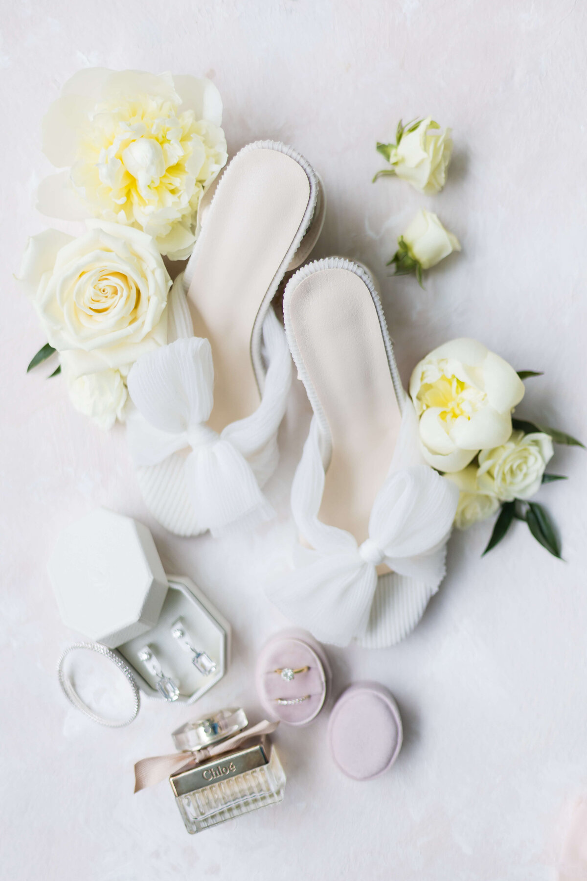 wedding shoes, florals, rings and perfume for wedding flatlay at Nashville wedding