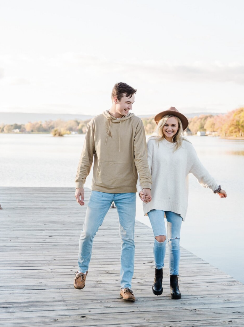 couple walking on a dock in Chattanooga for photos