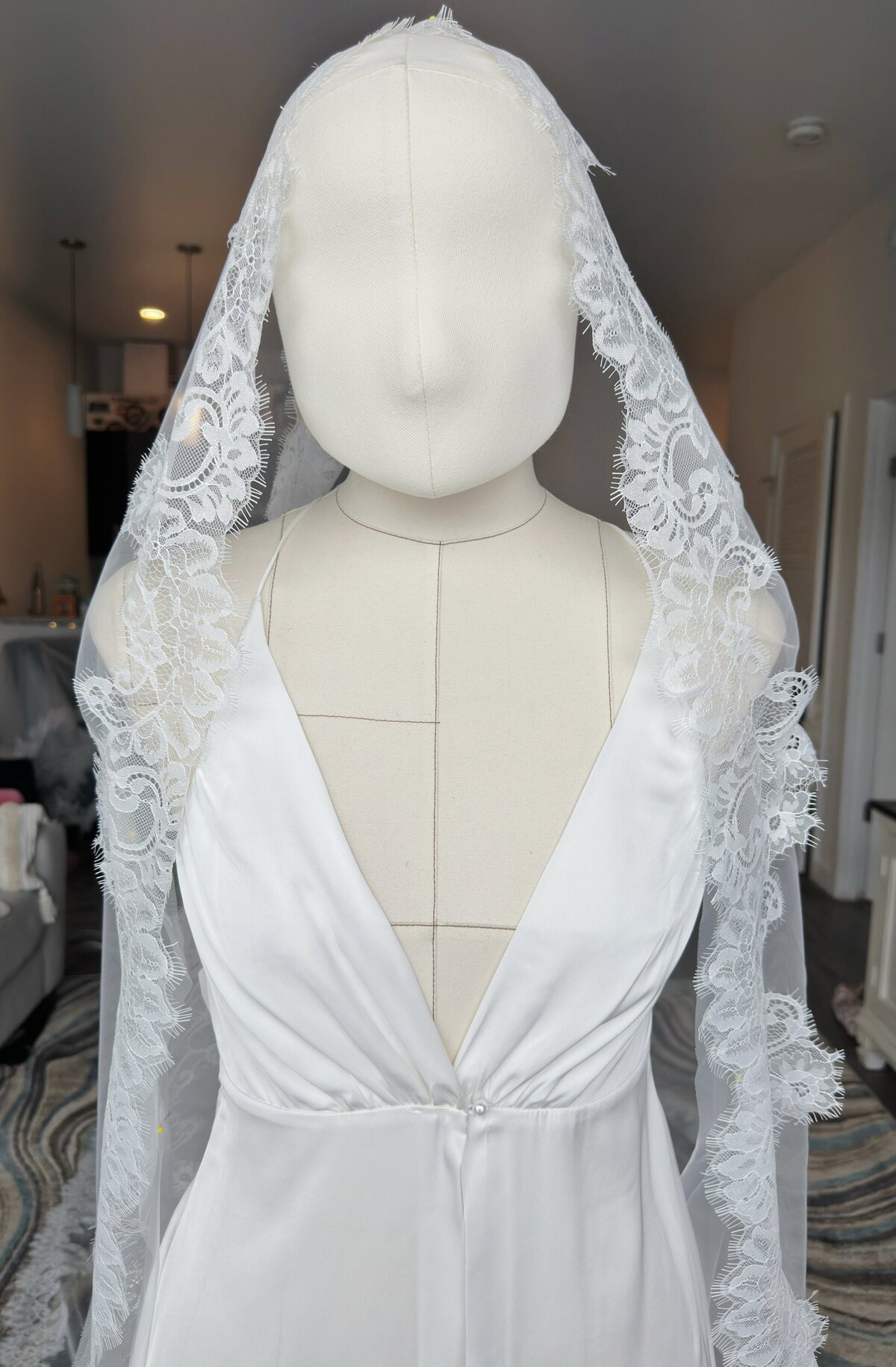 Hand-sewn lace mantilla veil featuring intricate floral patterns