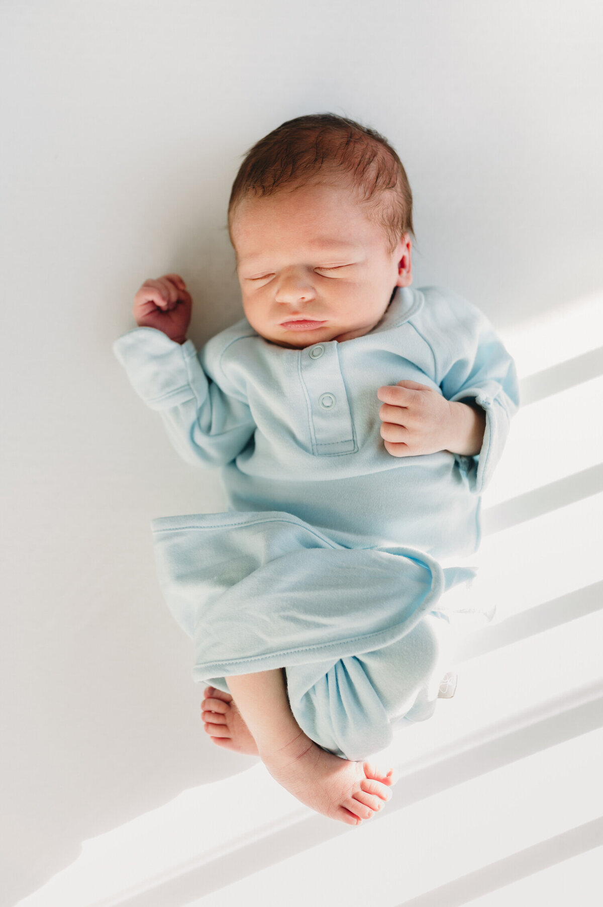 newborn baby boy in a crib