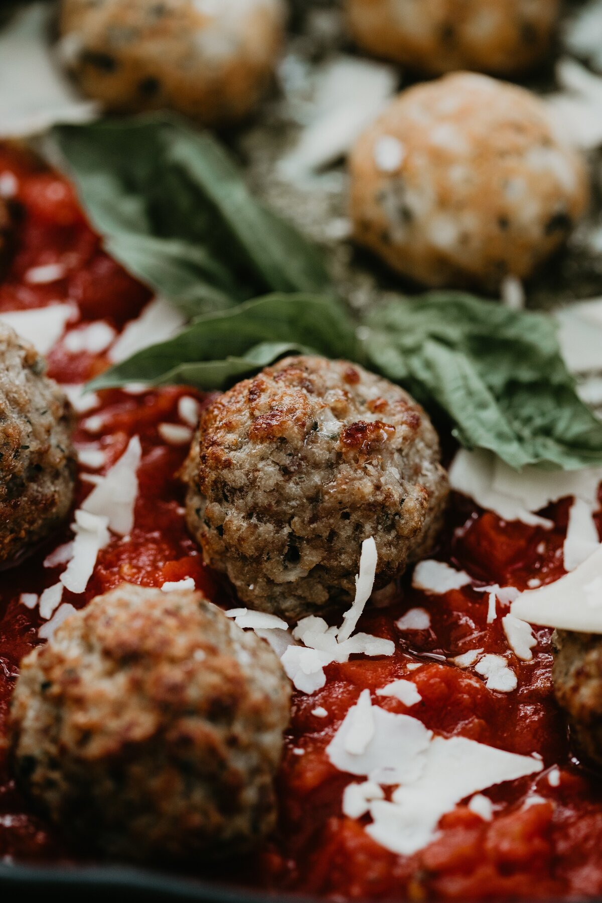 image of delicious chicken pesto and traditional beef marinara meatballs with fresh garden basil garnish served at Willowbrook wedding venue in Pittsburgh