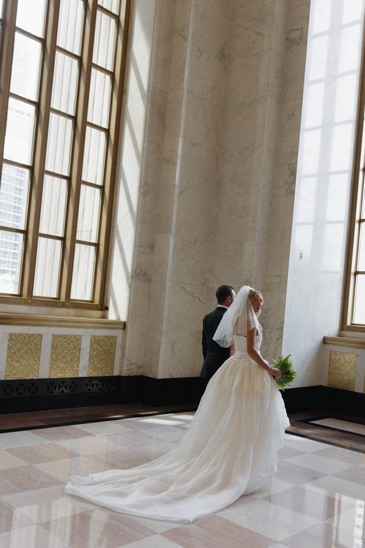 Fashion forward editorial wedding photography showcases ceremony elegance at Old Post Office Chicago, featuring Lauren Alatriste's sophisticated approach combining architectural beauty with magazine-worthy imagery and authentic wedding day emotion.