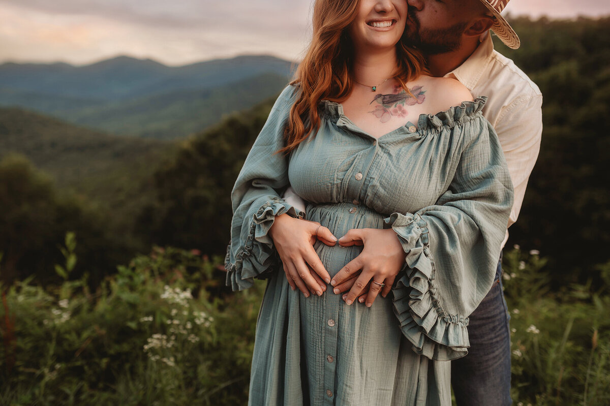 Expectant parents embrace during Maternity Portrait Session in Asheville, NC.