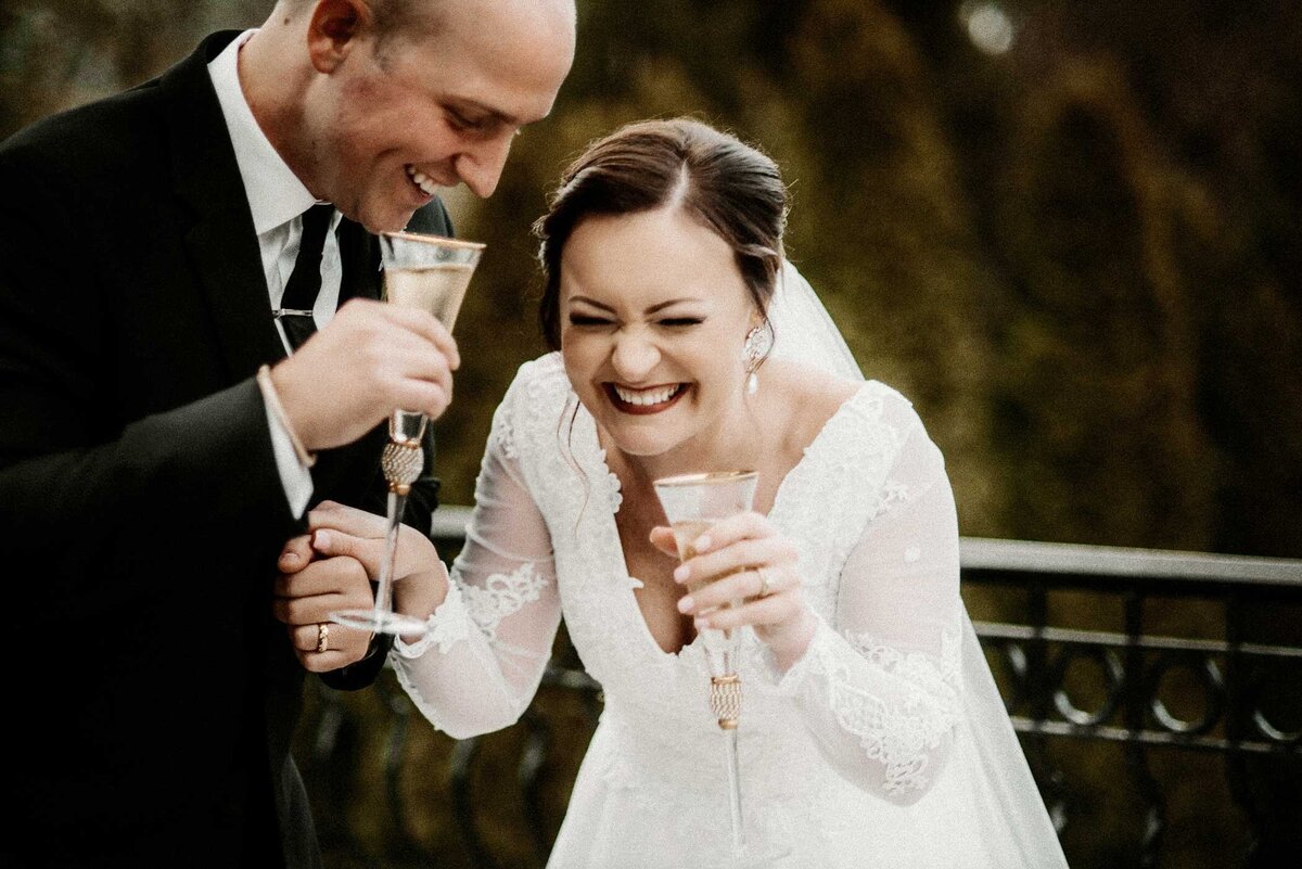 bride-and-groom-laughing-drinking-champagne-st-louis-missouri