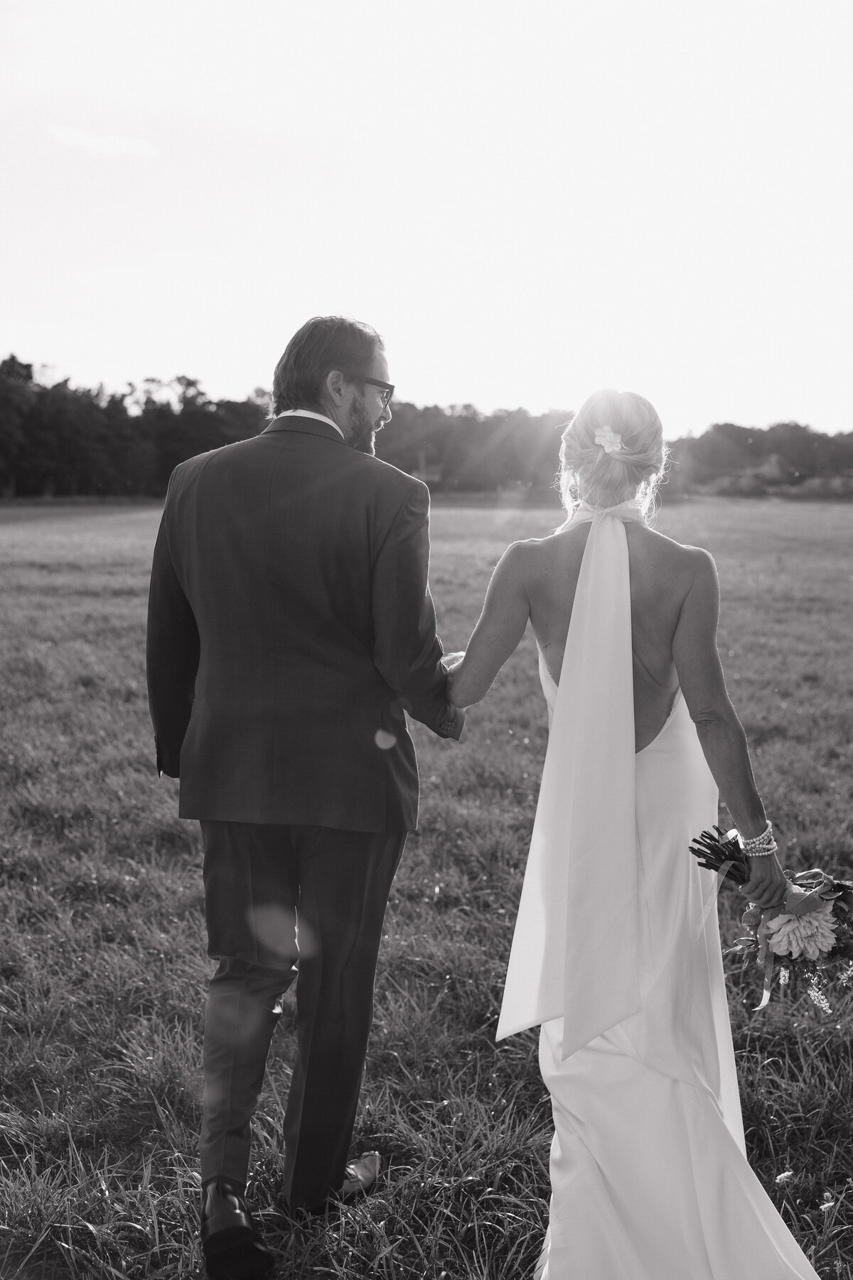 Ryann photographing a couple, bringing authenticity and warmth to wedding photography in Indiana and beyond.