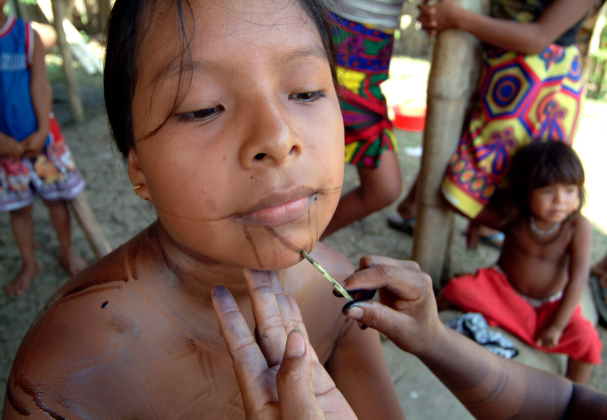 Bodypainting for ceremonial dances involves a mother's artistic touch