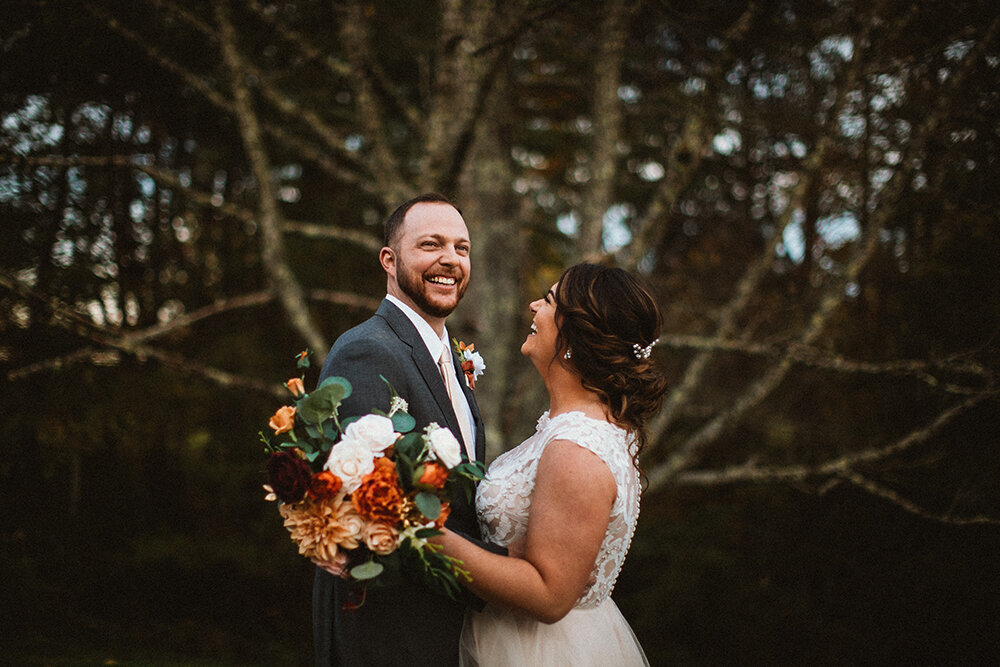 bride and groom share a laugh