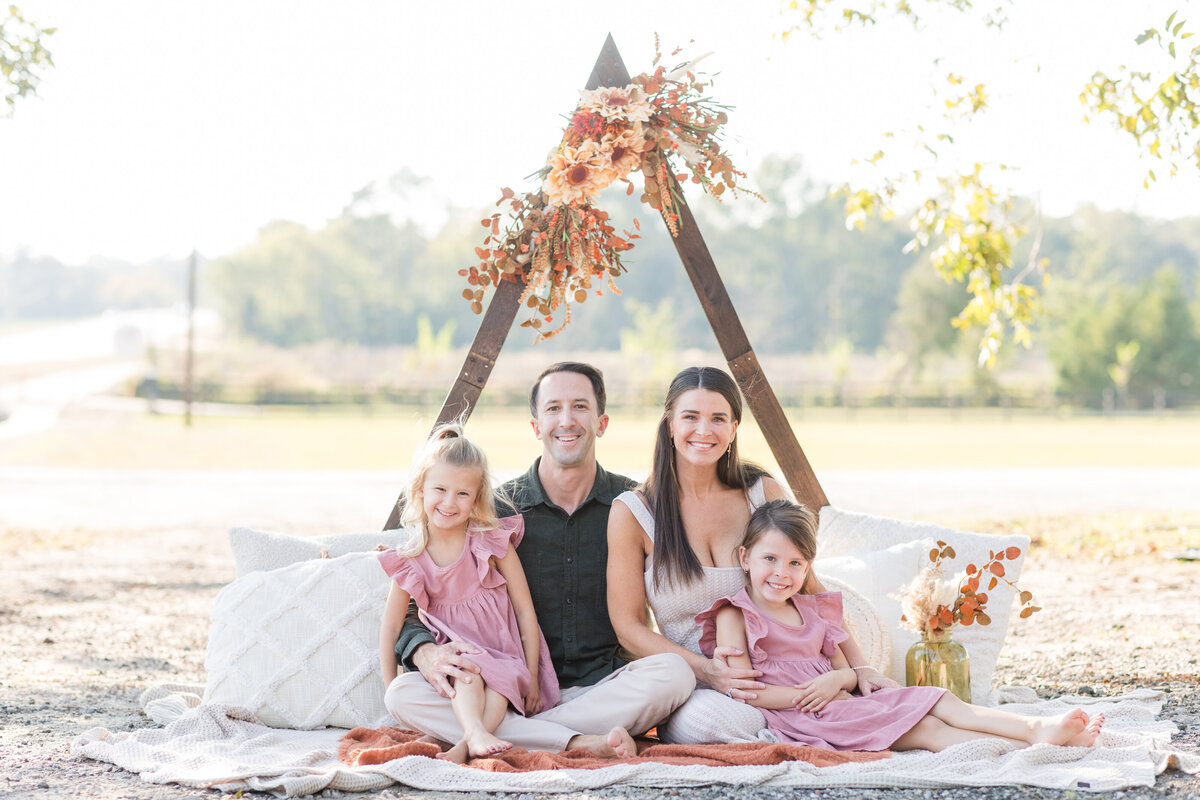 myrtle beach family sitting on ground for their family photography session